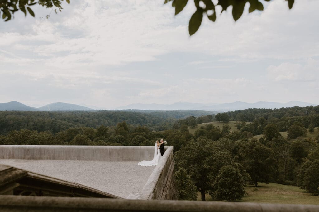 wide landscape shot of bride and groom on biltmore estate terrace