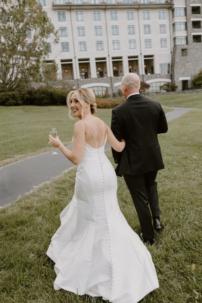 candid bride and groom moment outside the inn on biltmore estate